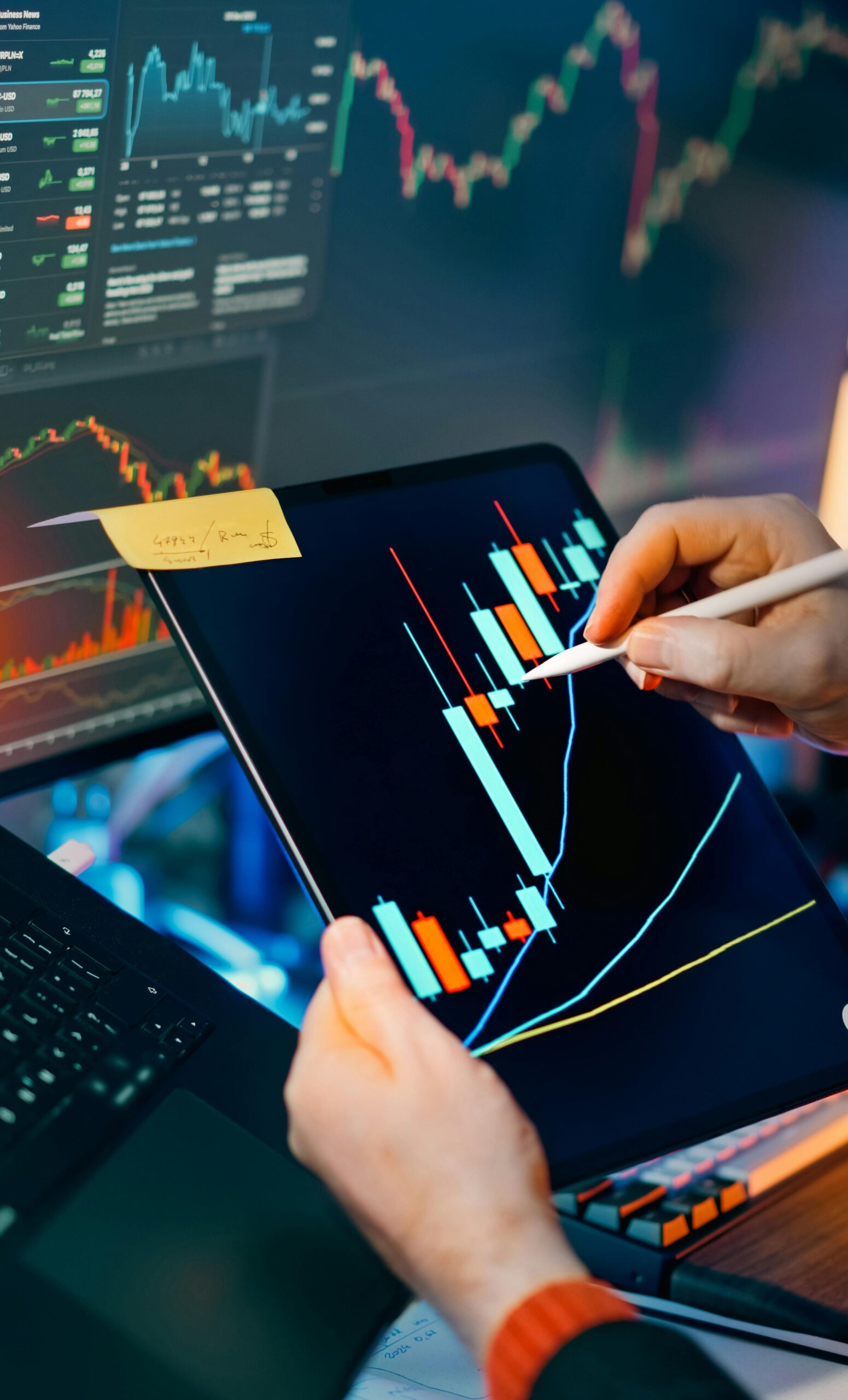 Person using a tablet to analyze financial charts showing Best Practices for Confidence Scoring in Prediction Models