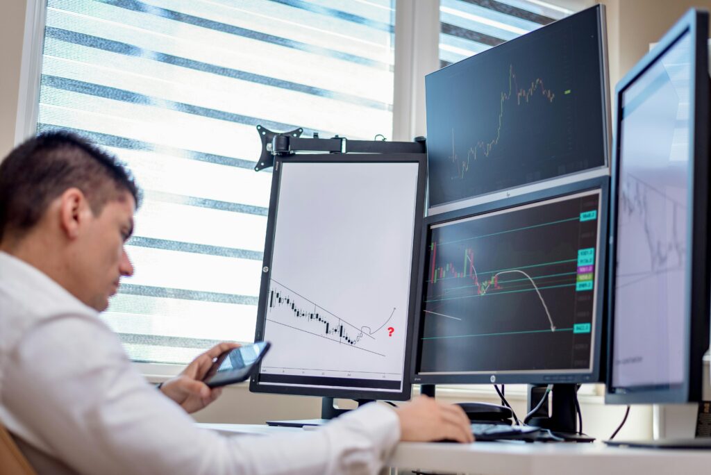 A stock trader analyzes financial data showing Common Prediction Trading Mistakes