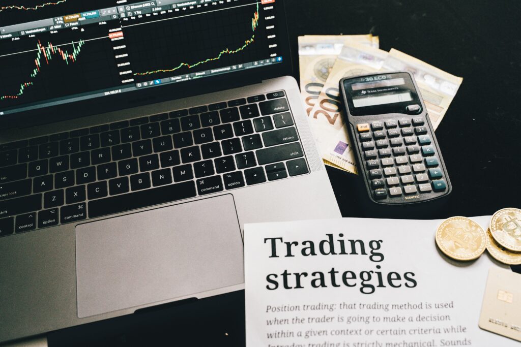Close-up image of a trading setup with a laptop, calculator, and financial documents, prediction markets are going mainstream